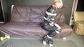 ***New Modell Courtney*** Wearing A Sexy Black Shiny Nylon Rain Pant And A A Black Rain Jacket Being Tied And Gagged With Tape And A Ballgag On A Sofa (Video)