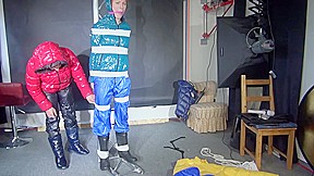 Sexy Ronja Wearing Shiny Nylon Downwear Being Tied And Hooded With Tapes From Stella On A Rack (Video)