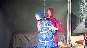 Sexy Sandra Being Tied And Gagged With Ropes And A Clothgag From Stella Both Wearing Sexy Shiny Nylon Agu Rainwear (Video)