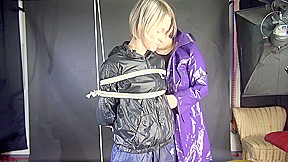 Watching Sexy Sonja Being Tied And Gagged Overhead With Ropes And A Clothgag From A Female Rigger Both Wearing Sexy Shiny Nylon Rainwear (Video)