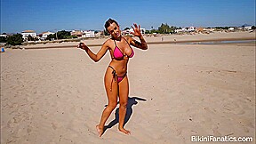 Busty bikini model exposes her boobs