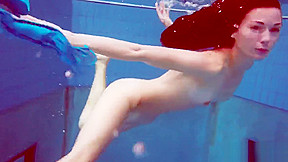 Redhead in blue bikini showing her body