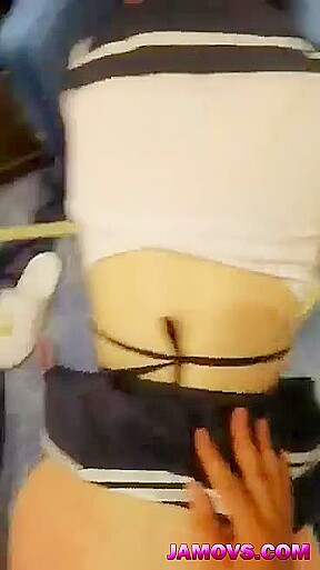 A young Chinese woman and her boyfriend watch