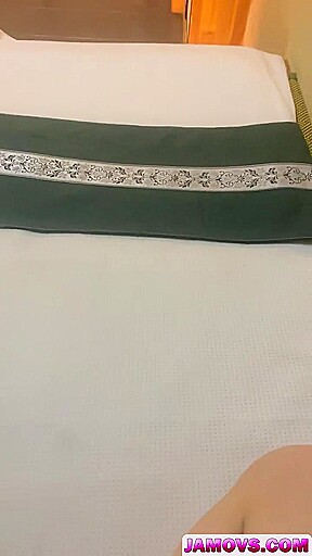 Asian masseur rubs clients clit and inserts her a sex toy