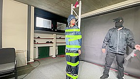 Marie M Tied, Gagged And Suspended In Shiny Nylon Rainwear