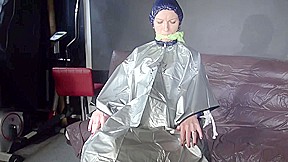 Sexy Ronja Being Tied, Gagged And Hooded On A Chair With A Clothgag Wearing Sexy Blue Shiny Nylon Rainwear (Video)